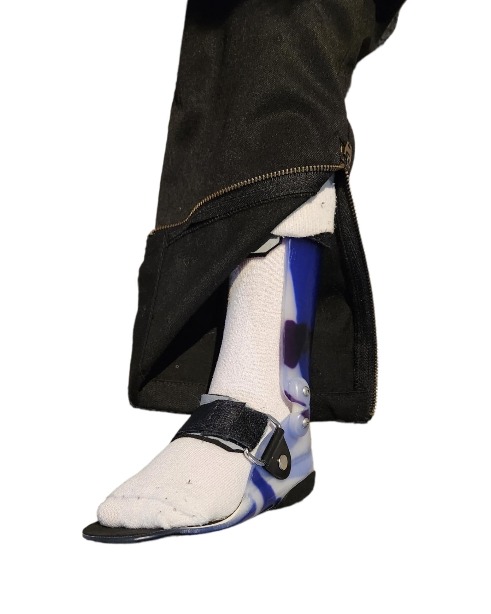 Lloyd style black cotton polyester trouser with metal zip at ankle, showing white sock and blue ankle foot orthotic AFO