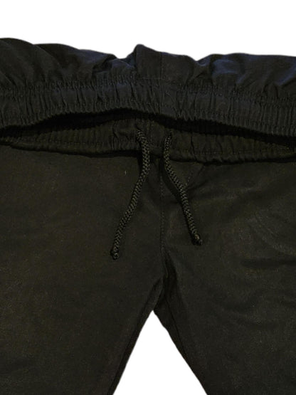 Close up of Lloyd style black cotton polyester trouser with polyester drawstring